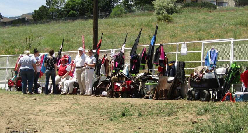 Costumes are staged along the fence, so riders can make quick changes between events.